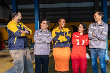 Obraz premium Small business, garage, mechanic, teamwork, confidence, multicultural technicians unite hands for job coordination, leadership support, communication, professional service mindset inside workshop.