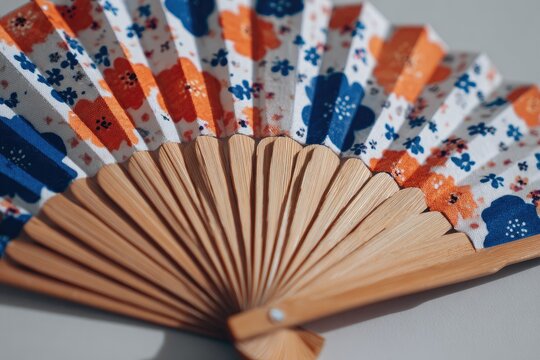 Floral paper fan, light wood