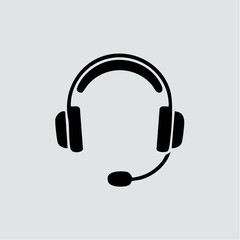 Fototapeta premium Simple black headset icon on a gray background.