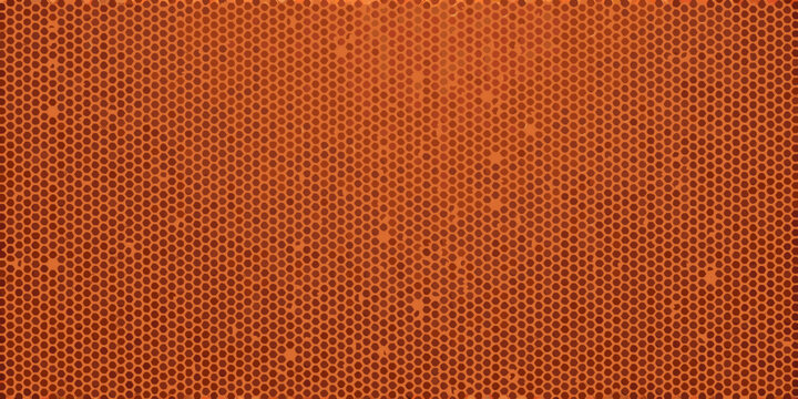 Close up of an orange basketball s textured surface with visible dimples