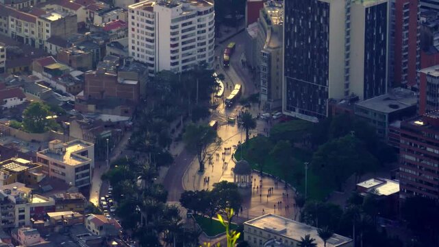 Bogota, Las Aguas. Rain falls over city streets at twilight. Transmilenium. Latin America. Traffic in Bogota, Transmilenio. Dedicated busway on the top level.