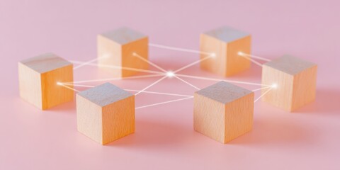 Obraz premium Wooden blocks connected by glowing lines representing a digital network and community social connections on a soft pink background with copy space for branding