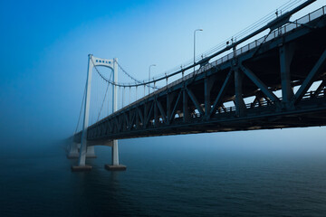 Fototapeta premium High-Definition Aerial View of Xinghai Bay Bridge in Dalian Covered by Sea Fog 