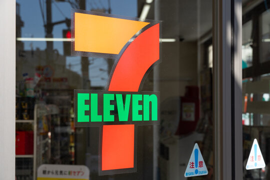NERIMA, TOKYO, JAPAN - MARCH 5, 2026: The official 7-Eleven logo displayed on the glass entrance door of a convenience store in Nerima City, Tokyo.
