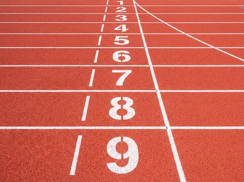 Red Athletic Running Track with Numbered Lanes One to Nine