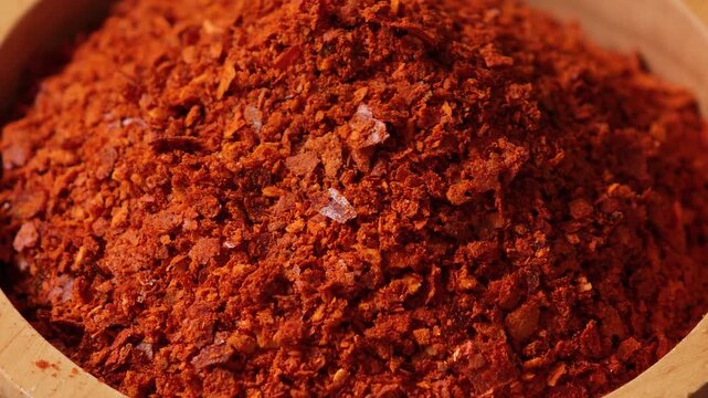 Chili powder in a wooden bowl.