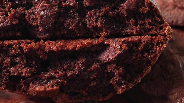 Close-up video of freshly baked brownie cubes, highlighting their crumbly crust and rich interior. 