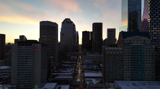 Aerial view of downtown Calgary cityscape by drone on a beautiful winter evening. 