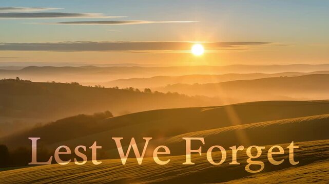Sunrise over misty rolling hills at dawn with golden sunlight rays 4K HD high quality video.
