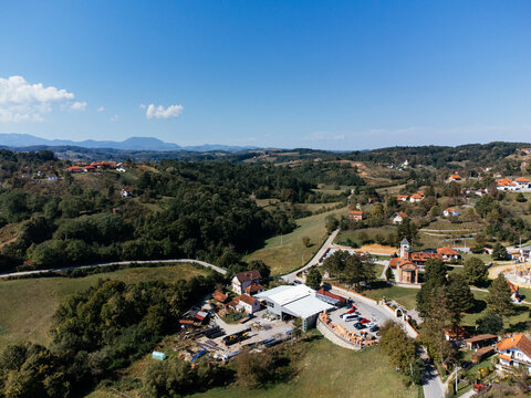 Aerial view of Church of Saint Basil of Ostrog near Valjevo, Serbia, surrounded by rural landscape. g.