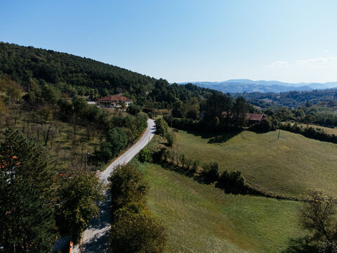 Aerial view of Church of Saint Basil of Ostrog near Valjevo, Serbia, surrounded by rural landscape. g.