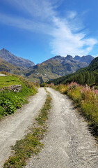 Gravel road leading to Lac du Chevril, Savoie, Auvergne-Rhone-Alpes, France, Europe.