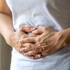 Woman Holding Her Stomach - Pain or Pregnancy