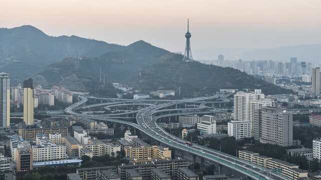 Night Time-lapse of Traffic Flow at Yuanshu Interchange with Xining TV Tower in Qinghai, China