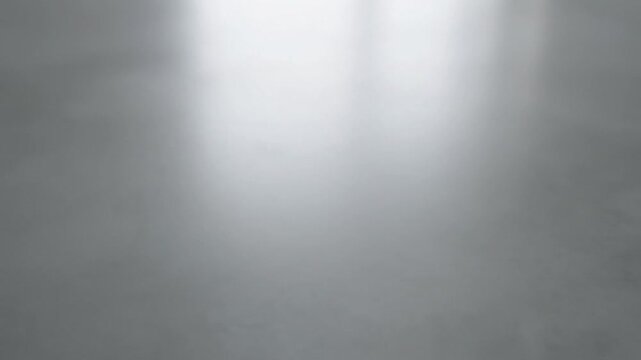 Gray Background with Bright White Light.