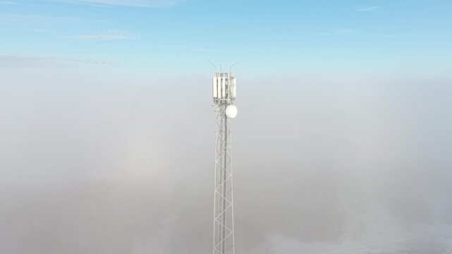 Snowy mountain landscape with a modern cellular mast