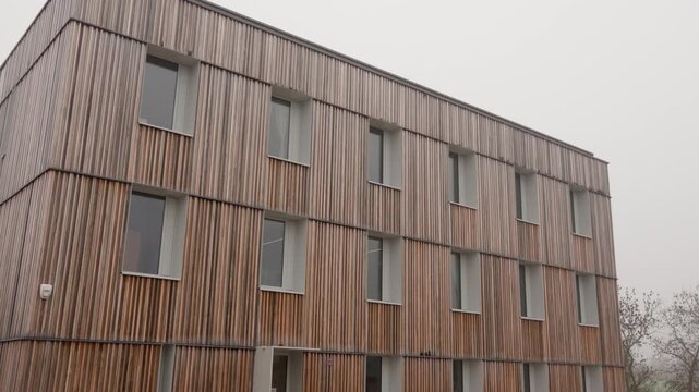 Building features a modern sustainable timber facade utilized in eco-friendly construction