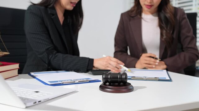 business people and lawyers discussing contract papers sitting at the table. Concepts of law, advice, legal services.	