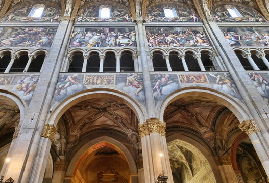 The Parma cathedral larelal view: Correggio frescoes and artworks details. Emilia Romagna, Italy.