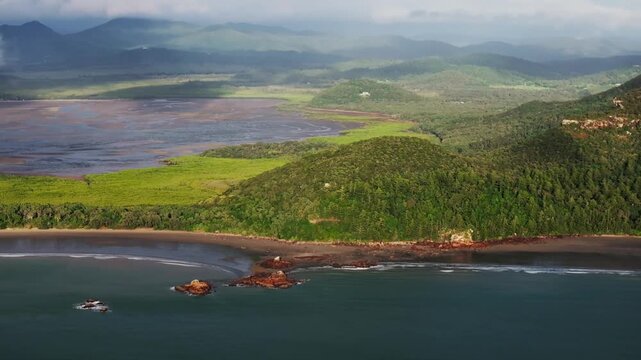 Cape Hillsborough National Park early morning sunny sunrise low rain cloud Australia aerial drone Hidden Valley Road Twin Casuarina Beach Cove waves Orchid Rock Lookout Wedge Island forward pan up