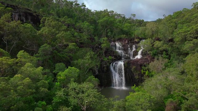 Cedar Creek Waterfall aerial drone Australia Falls Conway Forest Reserve Whitsunday island region blue sky cloudy tropical forest rainy season freshwater swimming Proserpine Airlie Queensland upwards