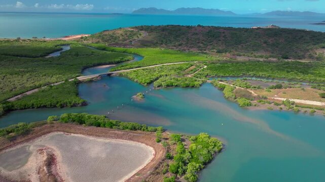 McCanes Bay Proserpine Bowen Jetty Coastal town Australia aerial drone landscape Horseshoe Bay Airlie Beach sunny marina bridge car harbor view Great Barrier Reef Whitsunday Region forward pan up