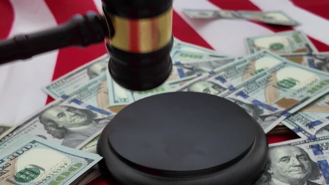 A gavel, once a symbol of authority and lawful order, now lies wrapped in scattered bills and shadowed by the weight of money. The judicial hammer that should strike with fairness and finality instead