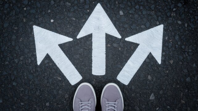 Decision Point: Navigating Life's Crossroads: A pair of feet stands before a fork in the road, three arrows pointing in different directions.