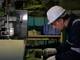 Worker assembling automotive components in modern factory