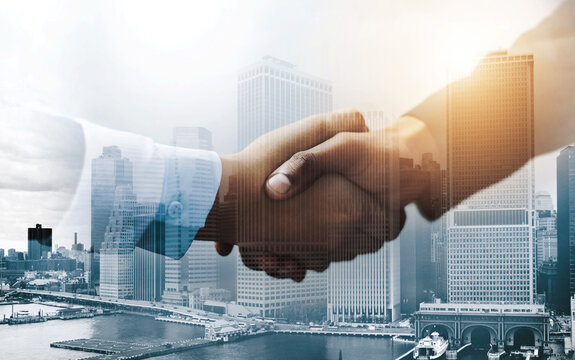 City, overlay or business people shaking hands for deal, partnership agreement or joint venture contract. Investment, collaboration or staff with handshake for merger, opportunity or double exposure