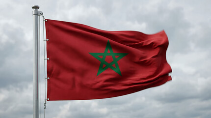 Moroccan national flag proudly waving in the wind against a cloudy sky.