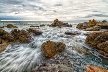 Obraz premium Sunset Ocean Seascape Landscape Dramatic Water Flowing Over Rocks Beautiful Tropical Nature Scenic Sunrise