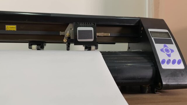 Paper plotter. Flatbed plotter. Vinyl. Stickers. Device. slow motion video. High quality 4k footage