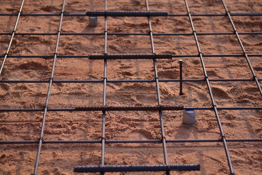 Subgrade preparation and reinforcement for concrete slab casting