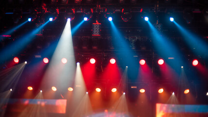 Professional Stage Lighting Rig with Blue and Orange Spotlights with copy space