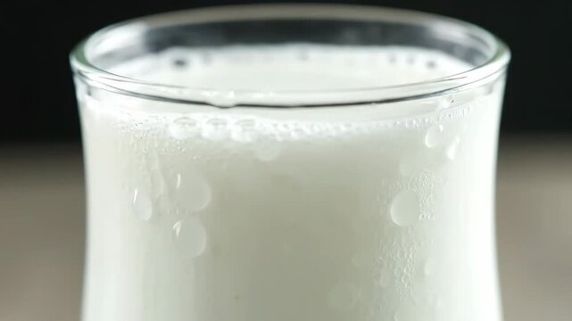 Macro view of traditional ayran yogurt drink smooth cinematic rotation