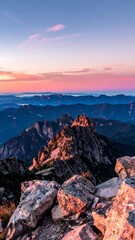 Fototapeta premium A serene mountain range at sunset with rugged peaks