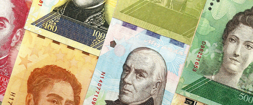 Venezuelan Bolivar currency money bills in pile. VED currency banknotes with different denomination close up