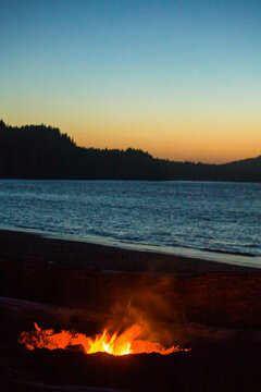 Beach fire on Puget Sound, Port Angeles, flames at dusk.