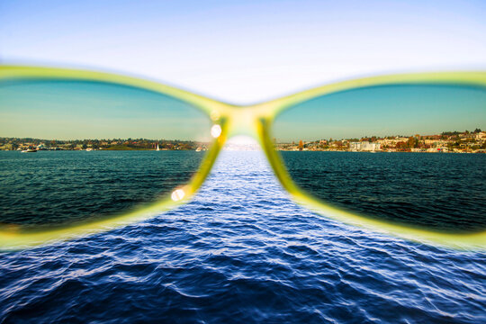 Seattle's Lake Union and the shoreline seen through sunglasses.