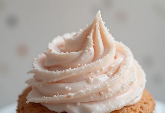 Delicious cupcake topped with smooth vanilla frosting and sprinkles. und kuchen