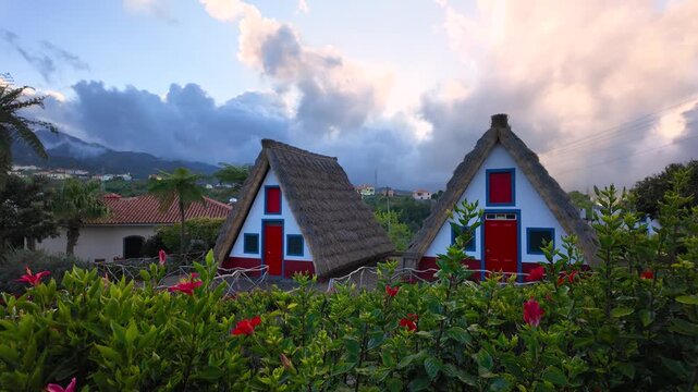 Traditional thatched roof houses in Santana, Madeira, a landmark of Madeira island, Portugal.
