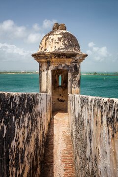A weathered sentry box sits at the edge of Castillo San Felipe del Morro in San Juan, looking over the Caribbean  Sea. 
