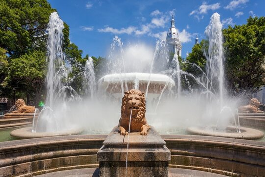 Daytime view of the Fountain of the Lions in Plaza Las Delicias, Ponce, Puerto Rico. Majestic lion sculptures spout water into the air 