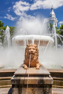 Daytime view of the Fountain of the Lions in Plaza Las Delicias, Ponce, Puerto Rico. Majestic lion sculptures spout water into the air 