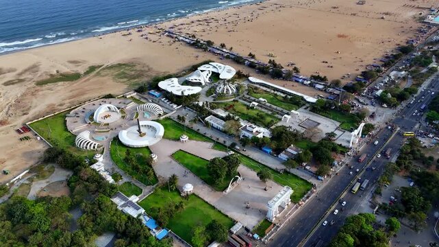 Aerial perspective of Chennai&rsquo;s memorial complex Anna, Kalaignar, MGR, and Jayalalithaa memorials stand in symmetry beside the vast sands of Marina Beach.**