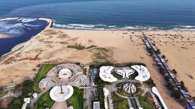 Aerial view of the Anna and Kalaignar Memorials alongside the MGR and Jayalalithaa Memorials iconic arches and landscaped grounds set against Marina Beach and the Bay of Bengal