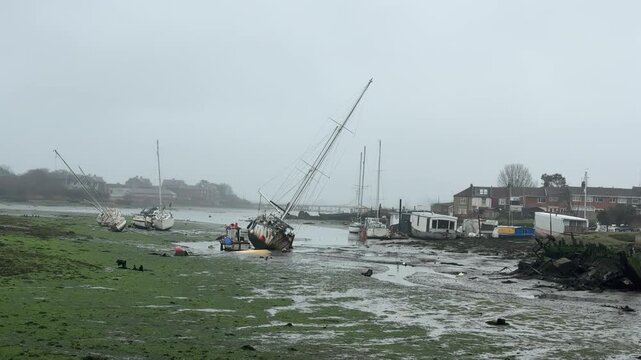 Abandoned Sailboats Tilted on Muddy Shore at Low Tide Gosport