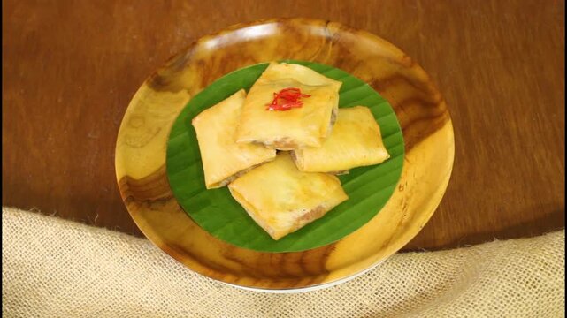 Indonesian Traditional Savory Snack Martabak Telur Mini on Wooden Plate