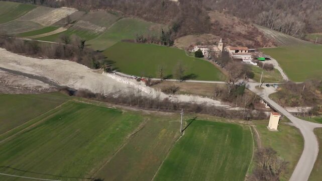 Arda River and bridge near Chiavenna Rocchetta with Chiesa di Sant'Ilario Vescovo in Lugagnano Val d Arda, Province of Piacenza, Emilia Romagna, Italy